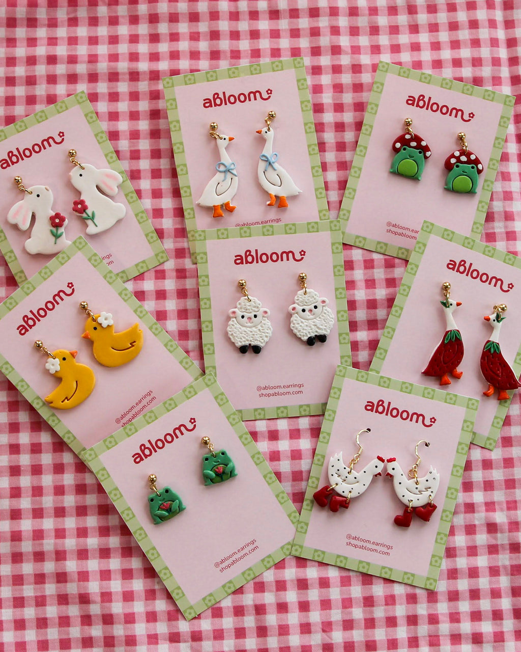 Set of colorful animal earrings on 'abloom' branded cards