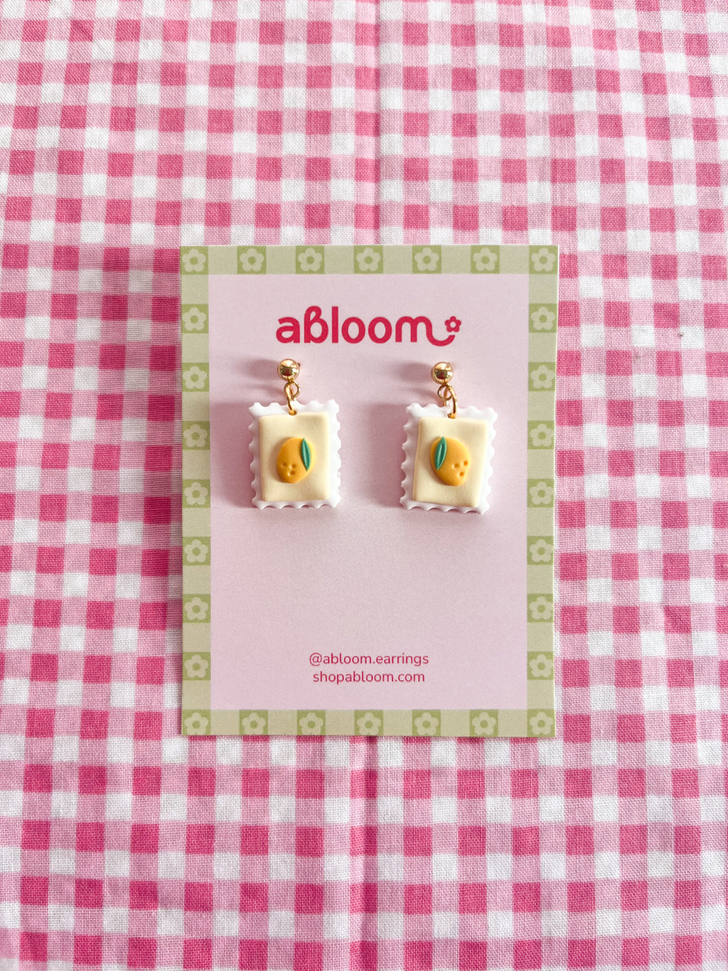 Cute whimsical fruit postage stamp earrings handmade from polymer clay
