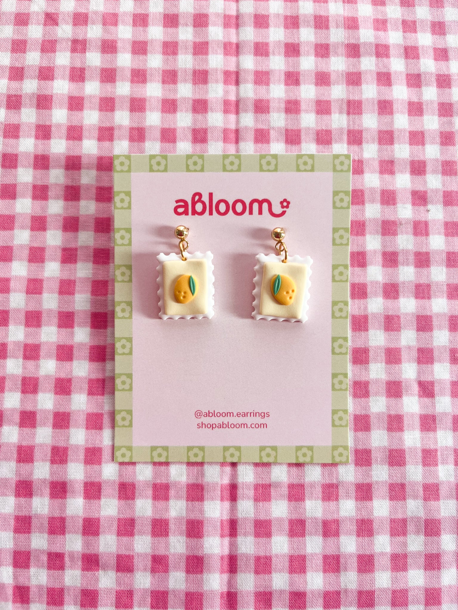 Cute whimsical fruit postage stamp earrings handmade from polymer clay