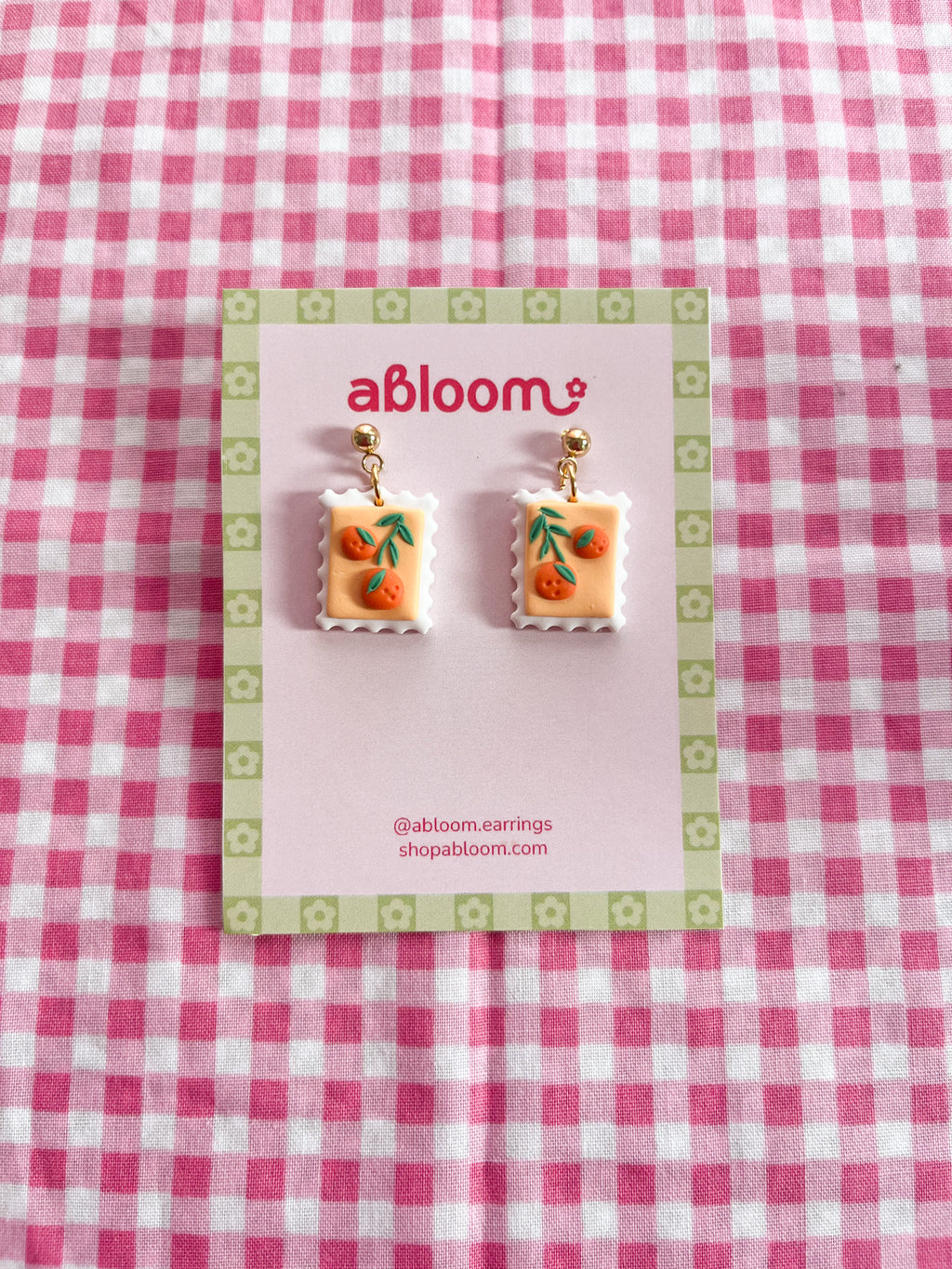Cute whimsical fruit postage stamp earrings handmade from polymer clay