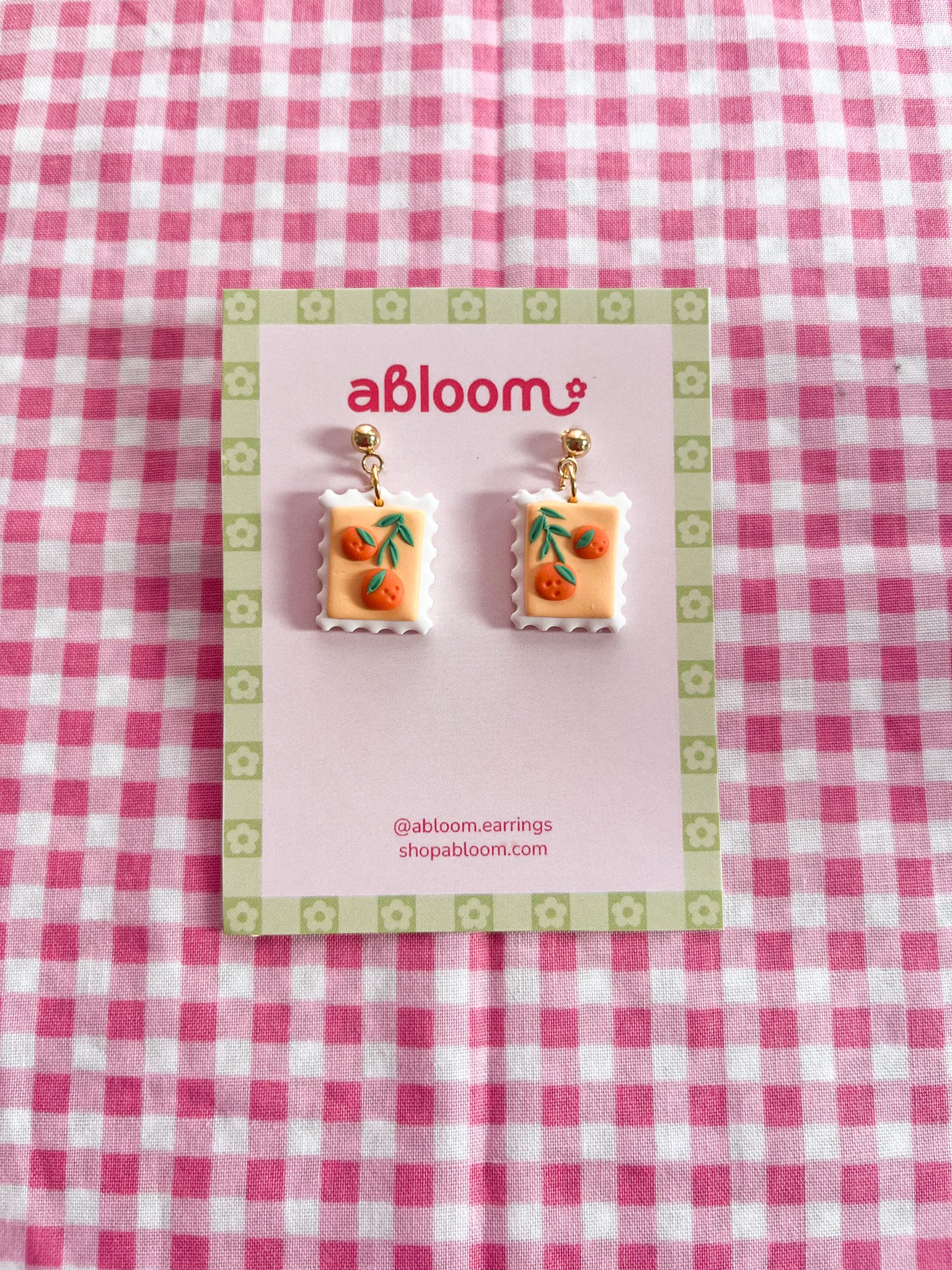 Cute whimsical fruit postage stamp earrings handmade from polymer clay