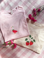 Cute pink strawberry goose graphic T-shirt with whimsical illustrated design and premium DTF print