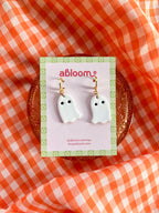 Simple white ghost earrings with a huggie hoop