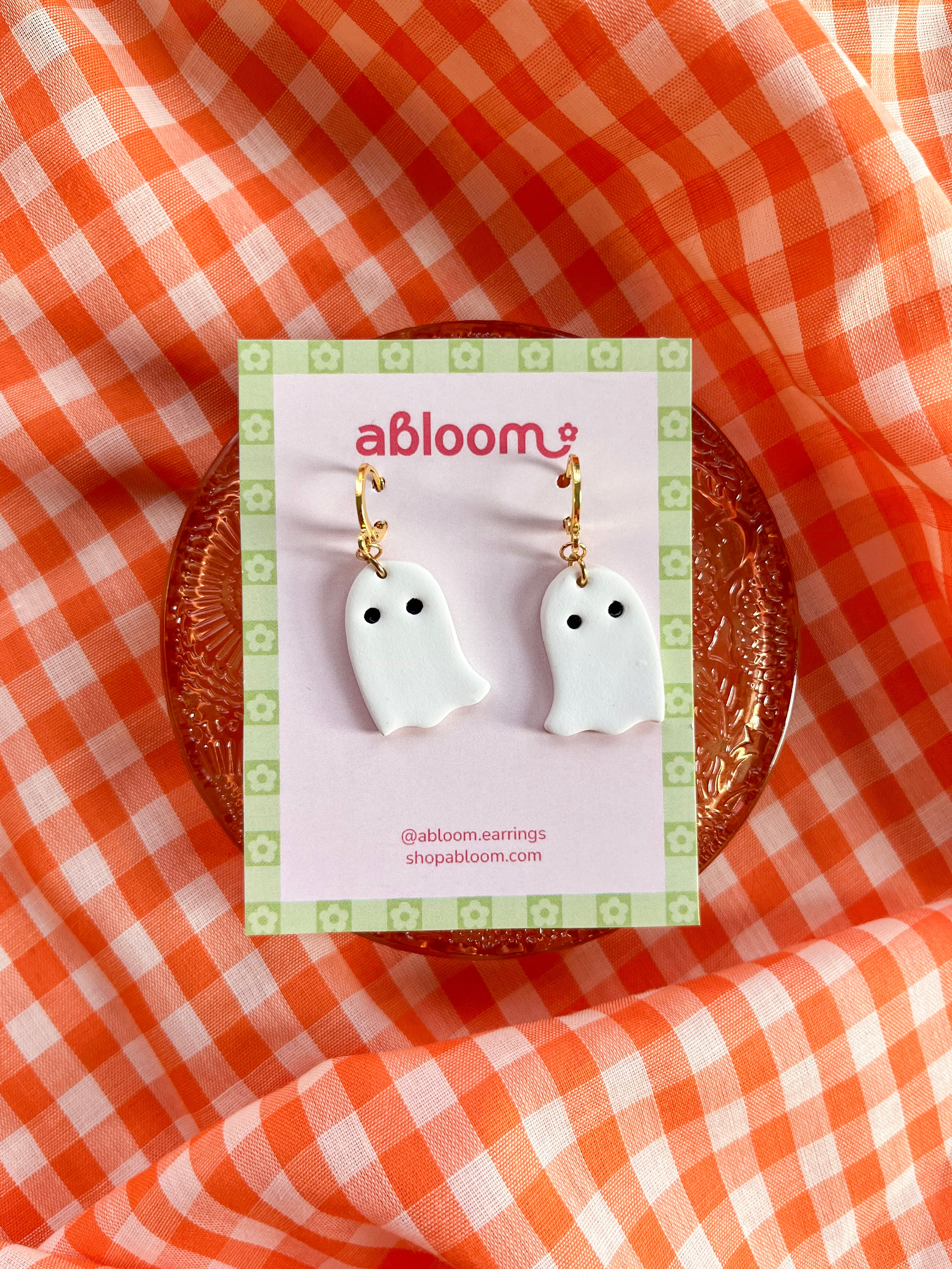 Simple white ghost earrings with a huggie hoop