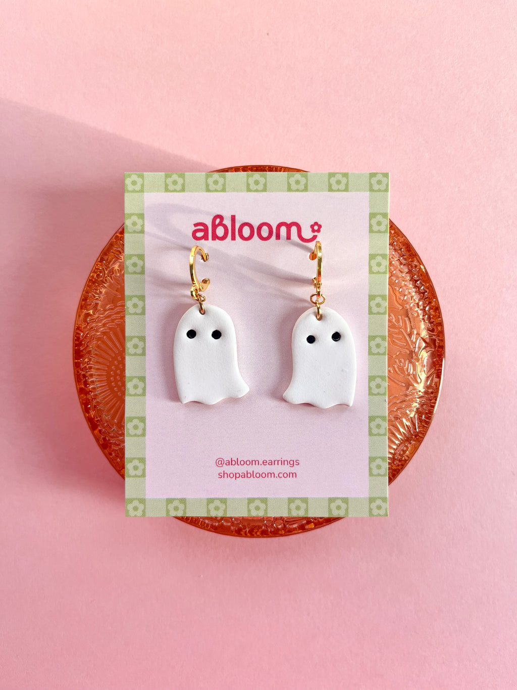 Simple white ghost earrings with a huggie hoop