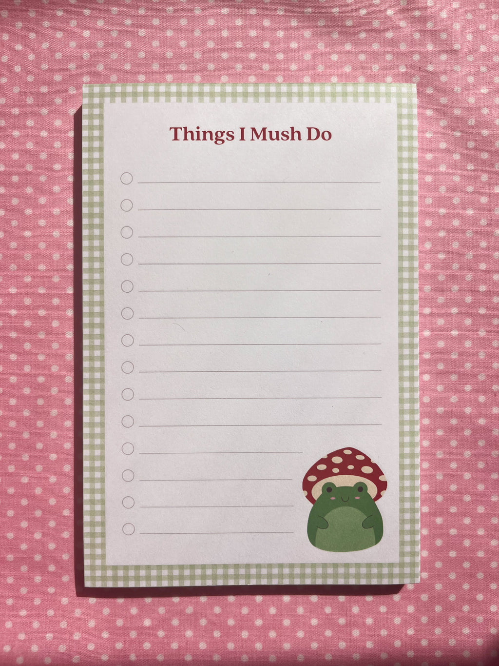 A lined to-do list notepad with the title "Things I Mush Do" and featuring a mushroom frog illustration in the bottom right corner. 