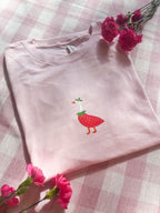 Cute pink strawberry goose graphic T-shirt with whimsical illustrated design and premium DTF print