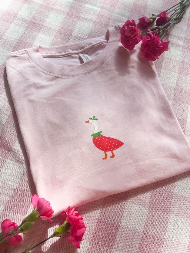 Cute pink strawberry goose graphic T-shirt with whimsical illustrated design and premium DTF print