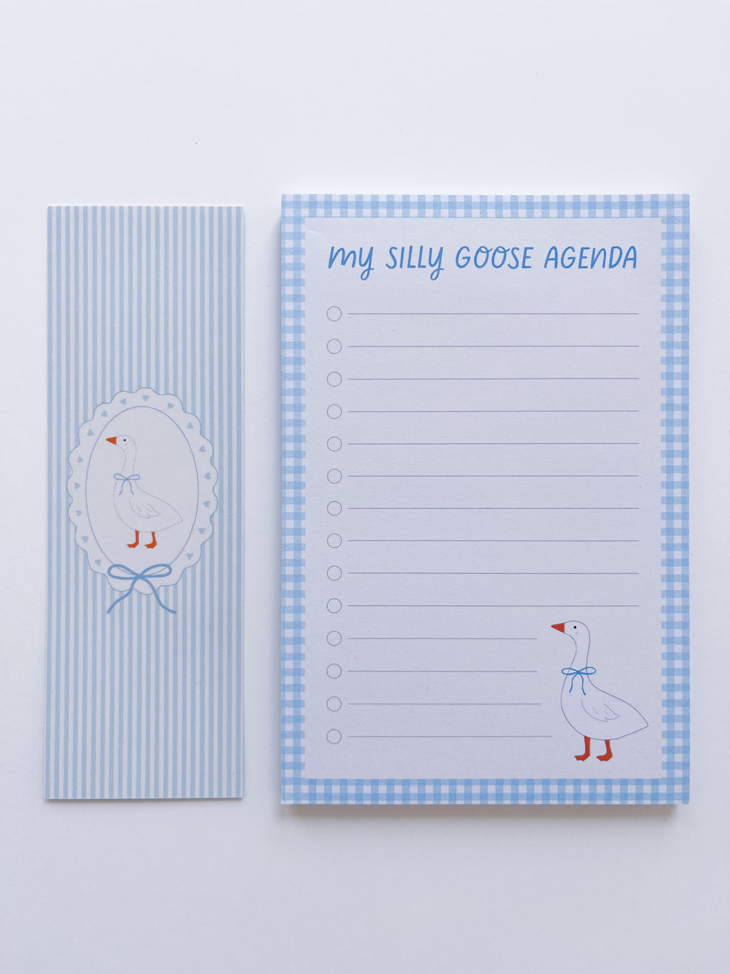 notepad and bookmark set with a goose design on a light blue background