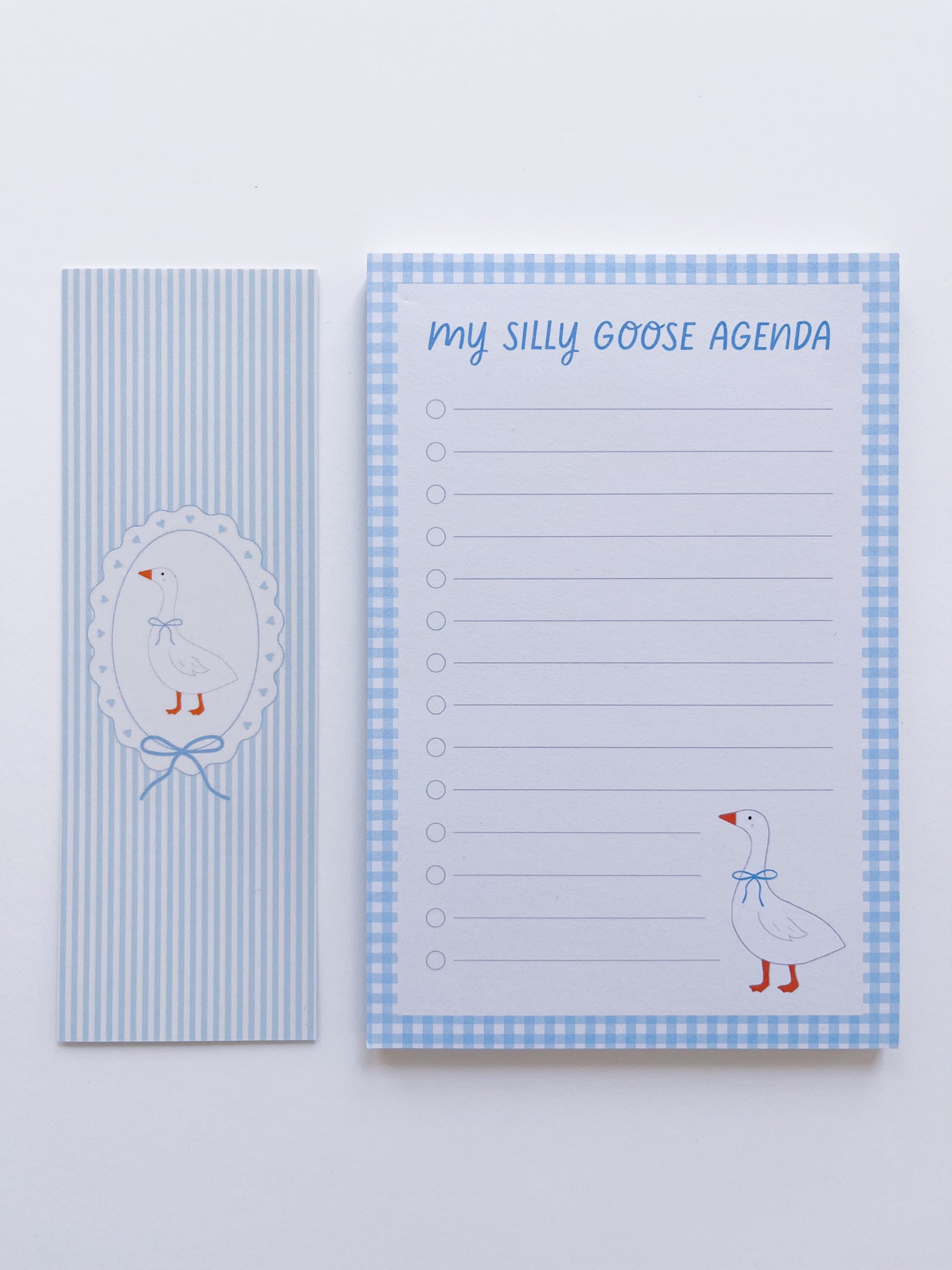 notepad and bookmark set with a goose design on a light blue background