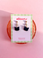 Cute black cat earrings with sparkling star charm handmade from polymer clay
