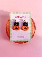 Cute black cat popping out of a pumpkin handmade polymer clay Halloween earrings
