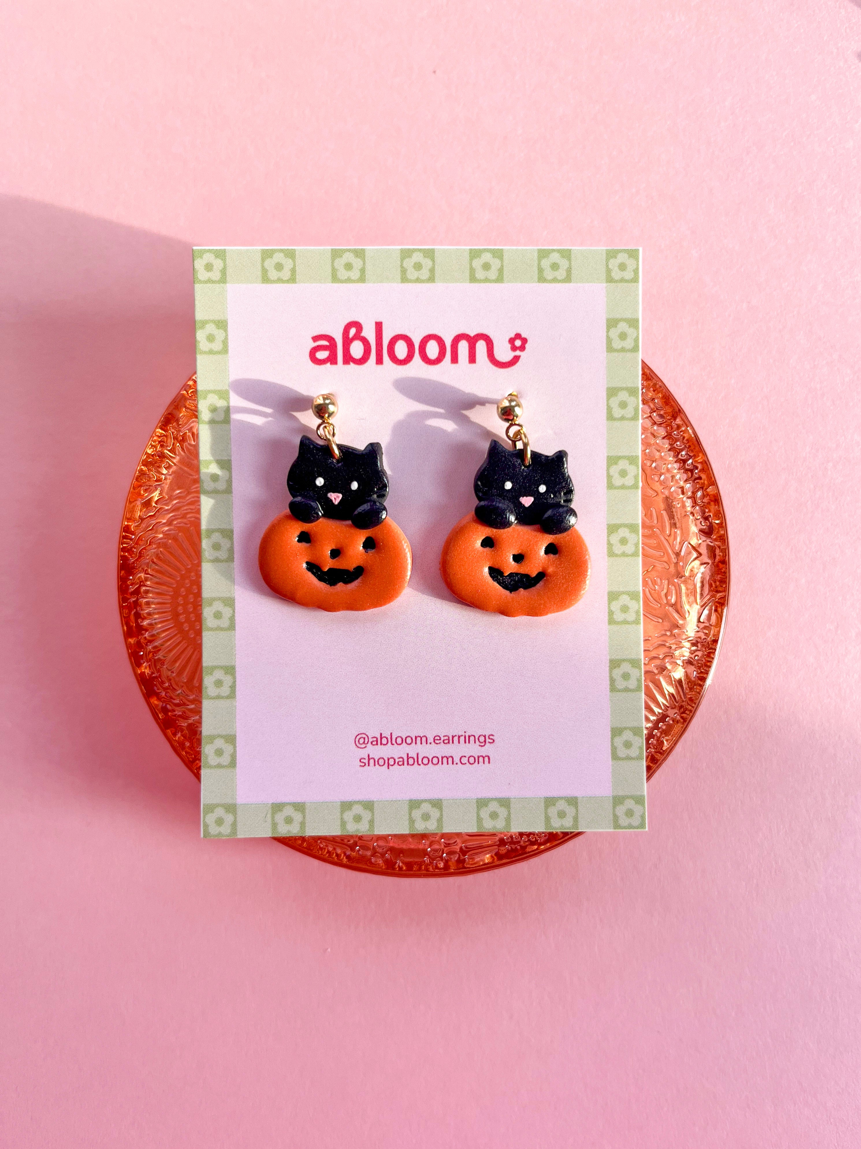 Cute black cat popping out of a pumpkin handmade polymer clay Halloween earrings