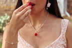 pearl necklace with a handmade polymer clay strawberry charm