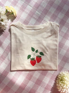 Cute strawberry daisy vines graphic T-shirt with whimsical floral illustration and premium DTF print