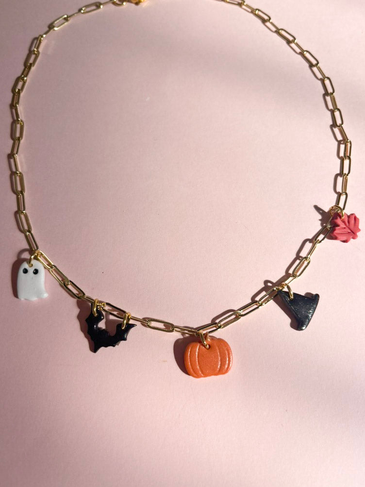 necklace with pumpkin, witch hat, bat, ghost, and maple leaf chams