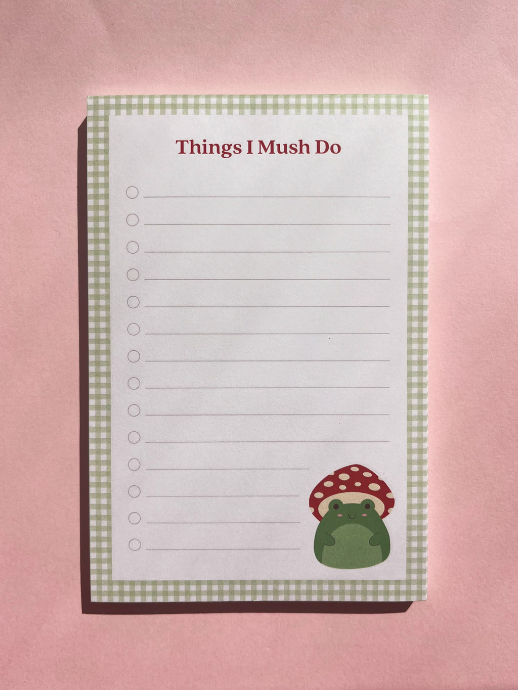 A lined to-do list notepad with the title "Things I Mush Do" and featuring a mushroom frog illustration in the bottom right corner. 