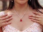 pearl necklace with a handmade polymer clay strawberry charm