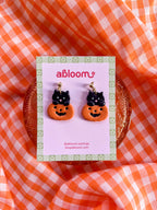 Cute black cat popping out of a pumpkin handmade polymer clay Halloween earrings