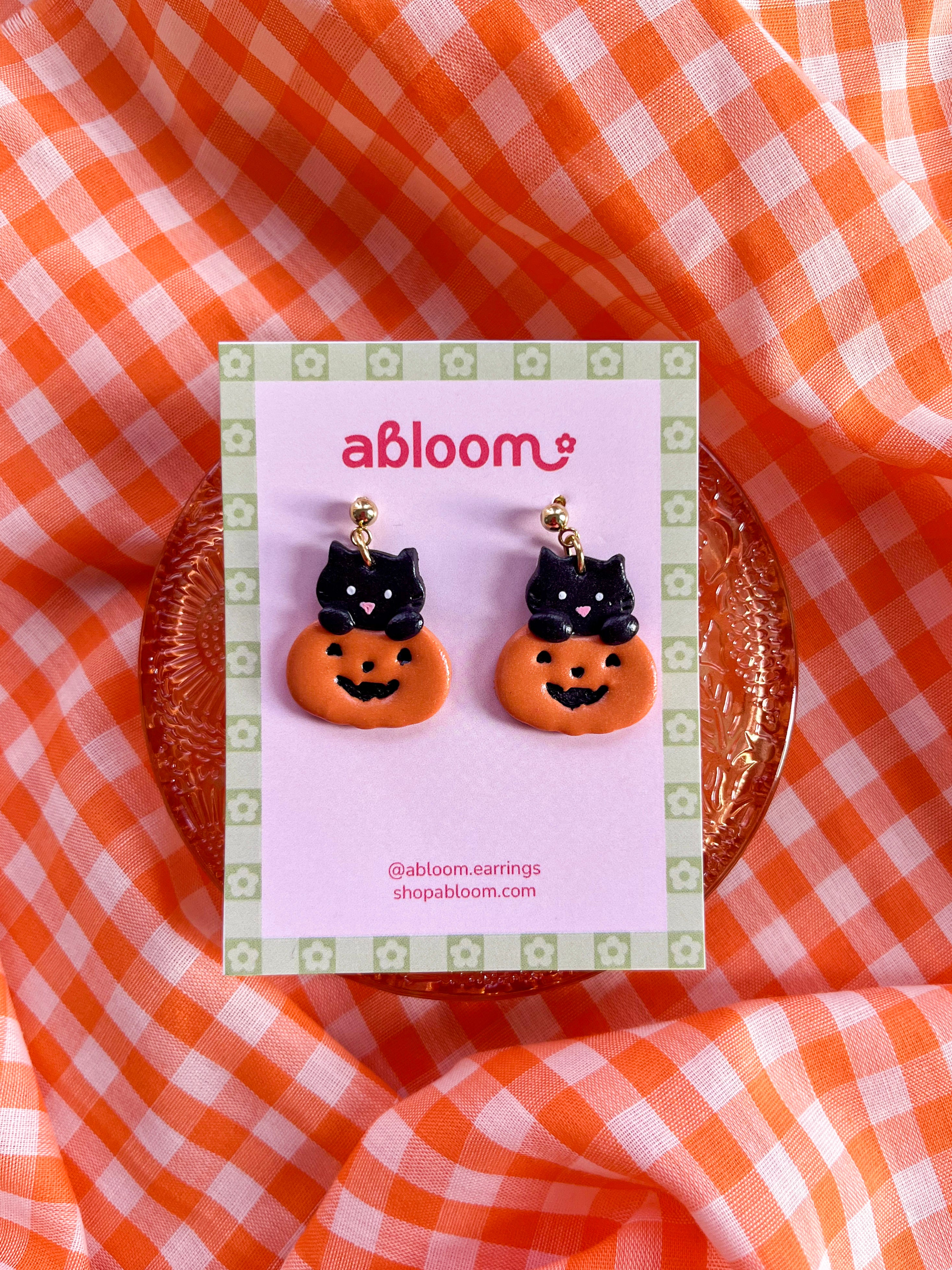 Cute black cat popping out of a pumpkin handmade polymer clay Halloween earrings