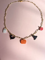 necklace with pumpkin, witch hat, bat, ghost, and maple leaf chams