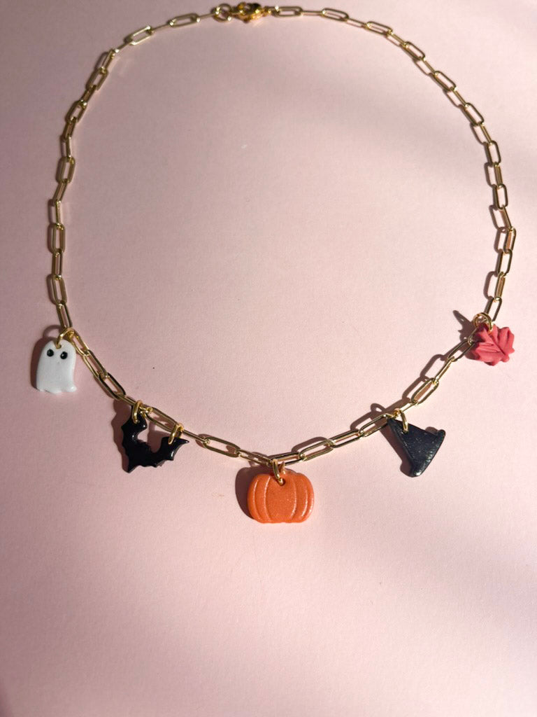 necklace with pumpkin, witch hat, bat, ghost, and maple leaf chams