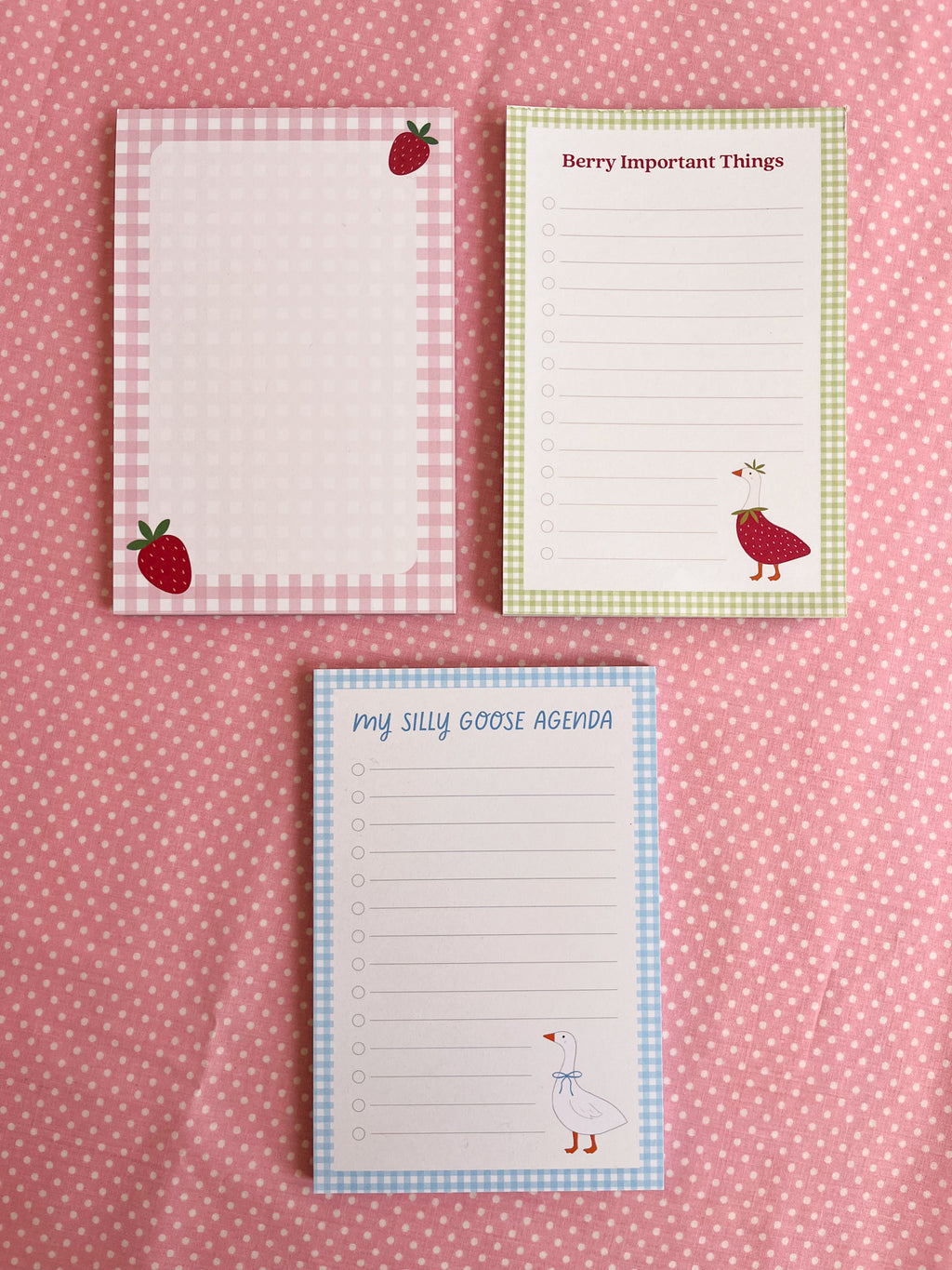 Three notepads with strawberry and goose designs 