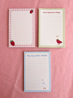 Three notepads with strawberry and goose designs 