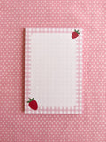 Notepad with strawberry design and gingham border