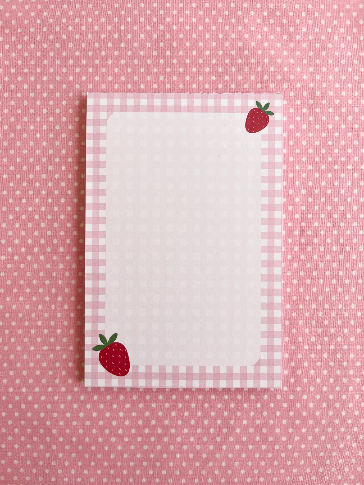 Notepad with strawberry design and gingham border