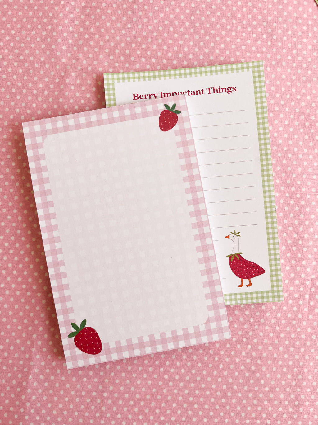 two strawberry gingham themed notepads