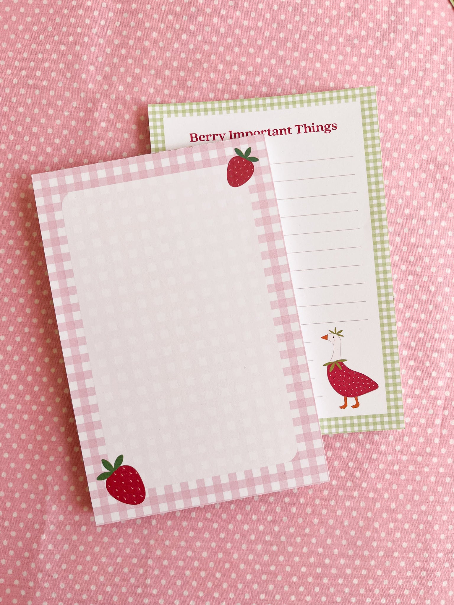 two strawberry gingham themed notepads